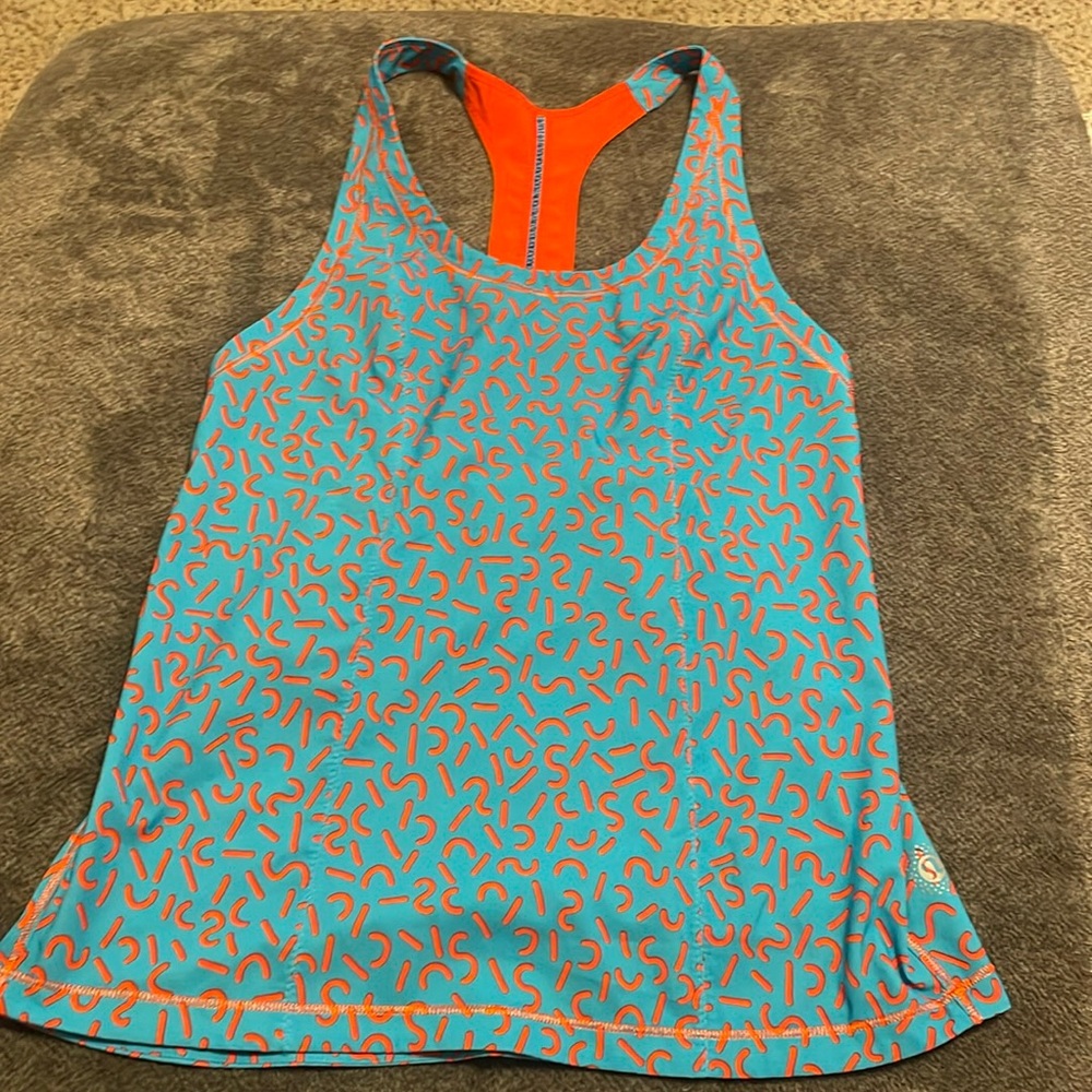 Lululemon athletic tank top size 2 or XS. Bright orange and teal